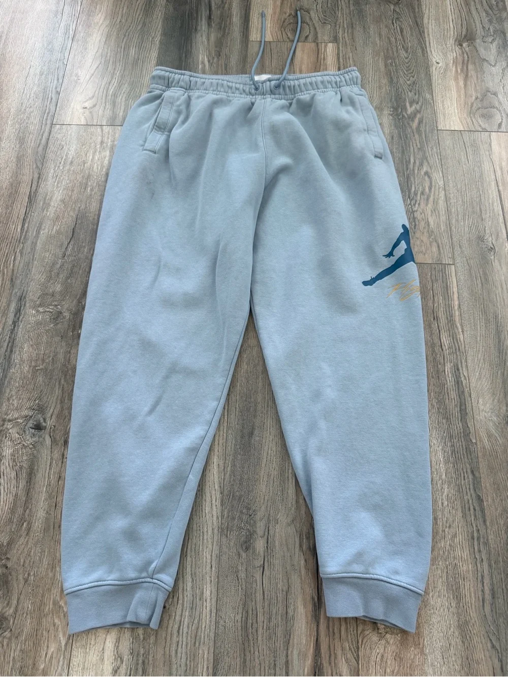 Jordan Essentials Men's Fleece Baseline Trousers in the Blue size XL with stains